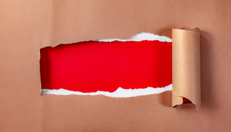 red header in torn paper holeの素材