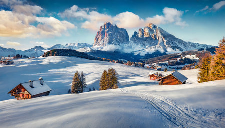 christmas postcard bright winter view of alpe di siusi village with plattkofel peak on background incredible morning scene of dolomite alps spectacular winter landscape of ityaly europeの素材