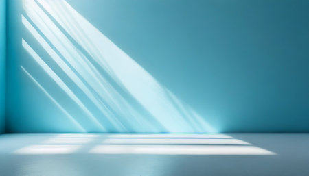 minimal abstract light blue background for product presentation incident light from window on wall and floorの素材