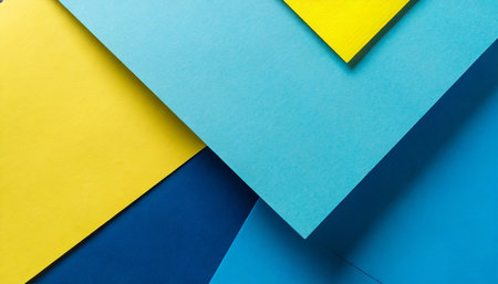 abstract color papers geometry flat lay composition background with blue and yellow tonesの素材