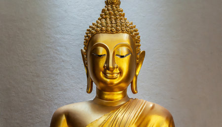 golden buddha statue with closed eyesの素材