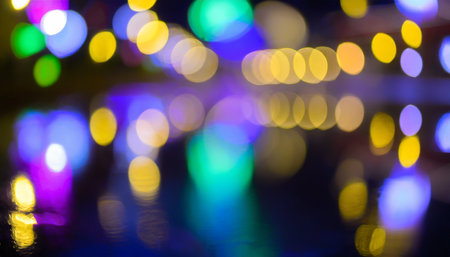 multi colored neon lights on a dark city street reflection of neon light in puddles and water abstract night background blurred bokeh light night view colorfulの素材