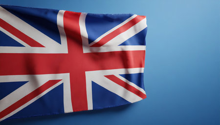 united kingdom flag on blue background with copy space 3d renderの素材