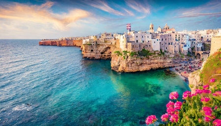 spectacular spring cityscape of polignano a mare town puglia region italy europe colorful evening seascape of adriatic sea traveling concept backgroundの素材