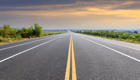 asphalt highway with road markings backgroundの素材