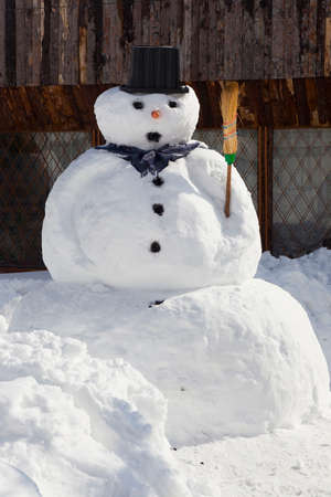 big snowman to fence