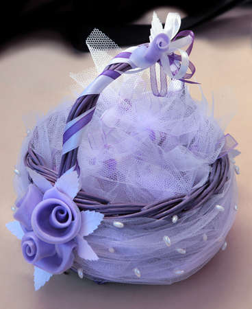 beautiful basket decorated with pearls and rosesの写真素材