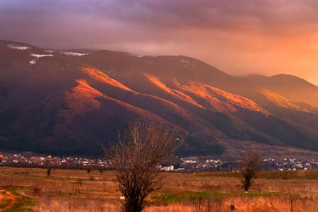 beautiful sunset over high mountain before the stormの写真素材