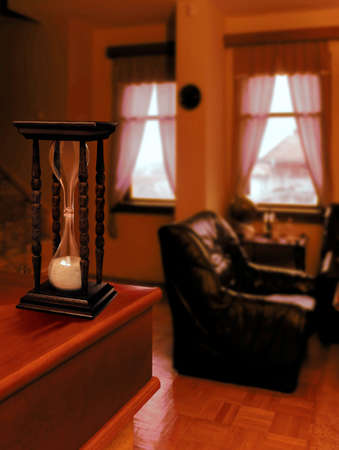beautiful hourglass counting down the old house