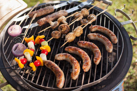 Fresh meat and vegetables grilled at a summer weekend barbecueの写真素材