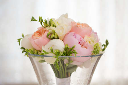 Pink flowers wedding decorations. Beautiful peonies in vasesの写真素材