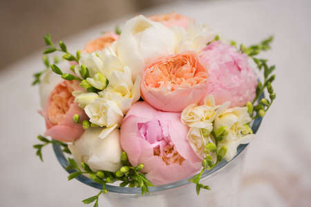 Pink flowers wedding decorations. Beautiful peonies in vasesの写真素材