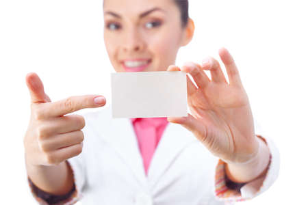 Business card closeup - businesswoman in white suit holding blank empty sign.の写真素材