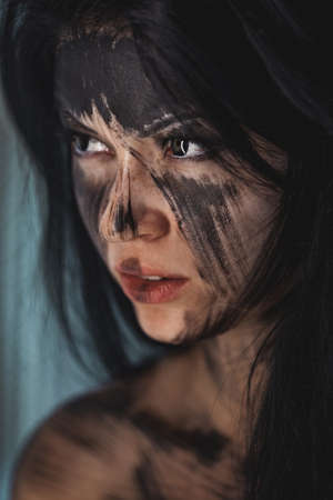 Spooky portrait of the woman. Demon theme on Halloween.の写真素材