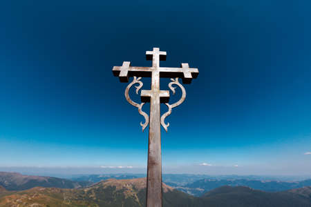 Cross at the top of Pop Ivan, mountain in the Carpathians. Concept of Forgiveness or Mercy ,Thanksgiving, Trust or Loveの写真素材