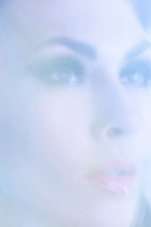 Close-up portrait of young attractive women in the mystical haze.