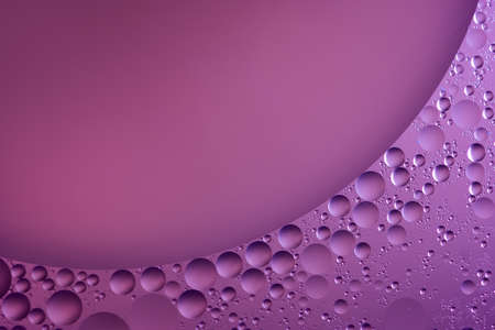 Abstract water bubbles light illumination background, art of water bubbles on water surface background. Abstract glare on bubbles and watery backgroundの写真素材