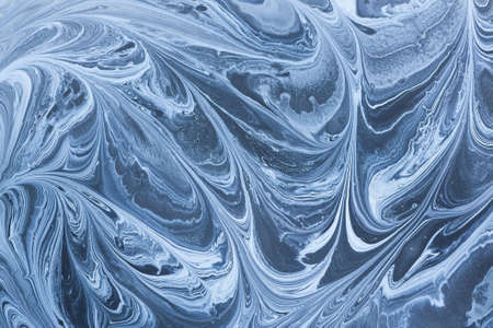 Creative ebru background with abstract acrylic painted waves. Beautiful marbling texture. Handmade...