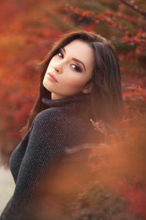 Autumn Woman Portrait. Beauty Fashion Model Girl with Autumnal Make up. Fall.