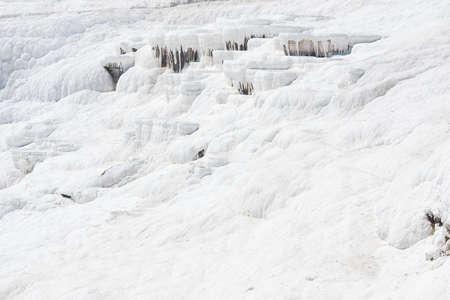 Pamukkale natural resort in Turkey, white salt hills background, snow white mountains. Pamukkale...
