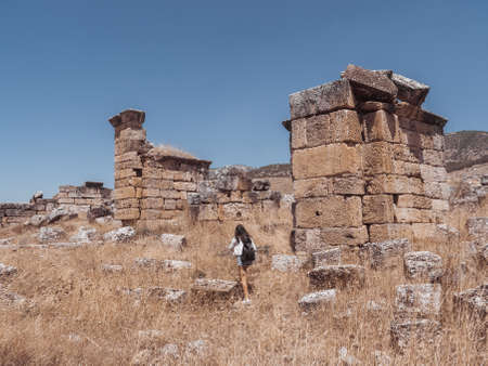 Ruins of ancient Hierapolis with tourist Pamukkale, Denizili, Turkeyの写真素材