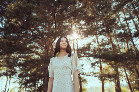 Free happy woman in forest enjoying nature. Natural beauty girl outdoor in freedom enjoyment...
