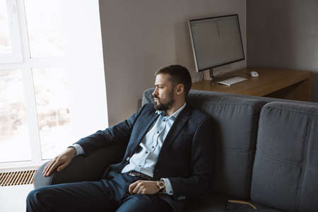 Thinking Ideas Strategy Working Concept. Modern businessman. Confident young man in a trendy suit...