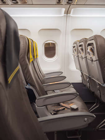 Airplane empty seat inside an aircraft. Restriction of travel concept.