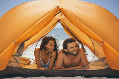 Couple on the Beach in a Tentの写真素材