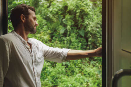 Travel and Exploration of Tourist Man by Train to Famous Landmarks in Sri Lanka.