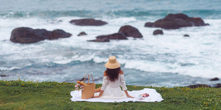 Elegant Beach Picnic for One Woman During Sea Vacationの写真素材