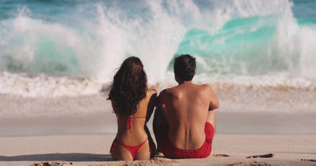 Ocean Waves Contemplation of Young Adult Tourist Couple on Tropical Beach