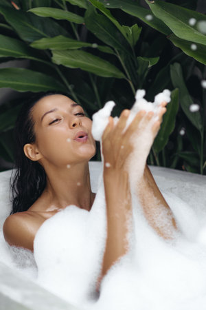 Bath and Body Care Treatment of Spa Woman in Bathtub, Tropical Bathroom Interior