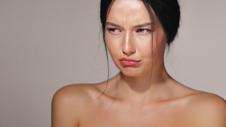 Woman with Pouty Face Showing Unhappiness and Glowing Skin