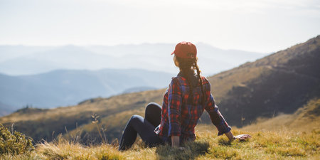 Woman Relaxing on Mountain with Scenic View in Carpathiansの写真素材