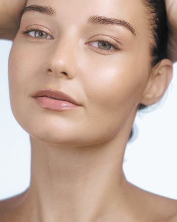 Close-Up Portrait of Woman Embracing Natural Beauty and Healthy Skinの写真素材