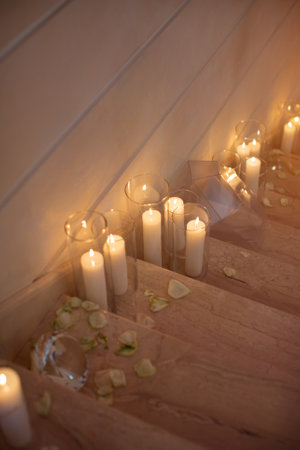 Romantic Candlelit Staircase With Petals For Elegant Event Decorationの写真素材