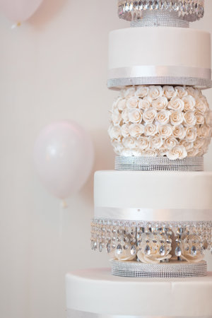 Luxurious White Wedding Cake With Roses And Crystal Accentsの写真素材