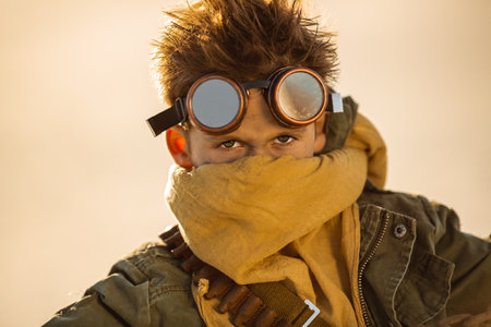 Post-Apocalyptic Warrior Boy With Goggles And Scarf In Desert Setting
