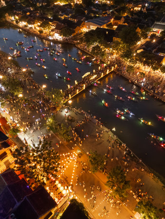 Drone Shot of Hoi An Lantern Boats and Crowds Illuminated at Nightの写真素材