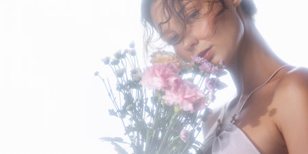 Romantic Woman With Pink Flowers In Sheer White Lingerie And Soft Lightの写真素材