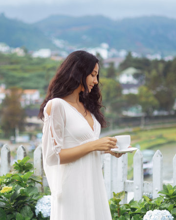 Serene Sri Lankan Tea Moment With Young Woman In Nuwara Eliya Plantation Garden