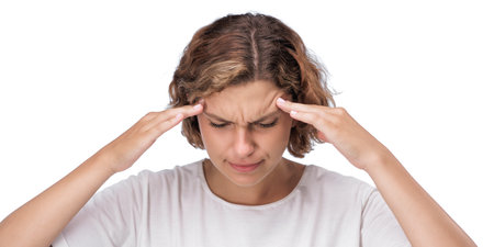 Caucasian Woman Experiencing Headache Holding Temples With Pained Lookの写真素材