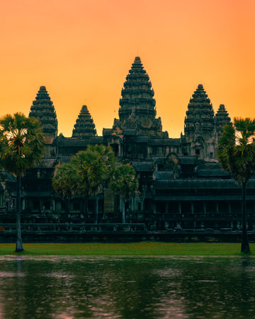 Magical Angkor Wat Temple In Cambodia At Sunrise With Vibrant Sky Reflectionの写真素材