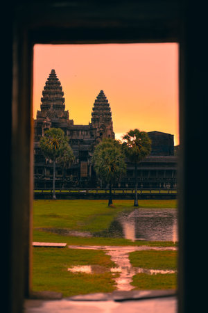 Angkor Wat Temple At Sunrise Framed By Ancient Stone Window In Cambodiaの写真素材