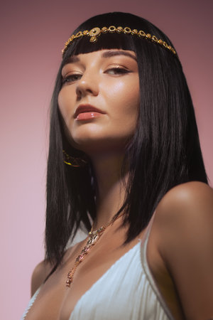 Modern Woman with Gold Jewelry and Elegant Attire