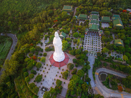 Drone View Of Lady Buddha Statue Surrounded By Linh Ung Pagoda And Green Forestsの写真素材