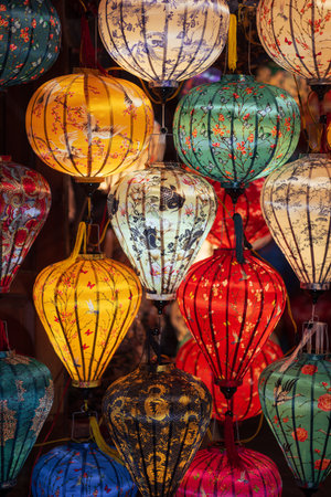 Colorful Handcrafted Lanterns with Floral Patterns in Vietnamese Marketの写真素材