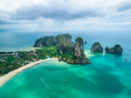 Aerial View Of Railay Beach With Emerald Waters And Limestone Cliffs