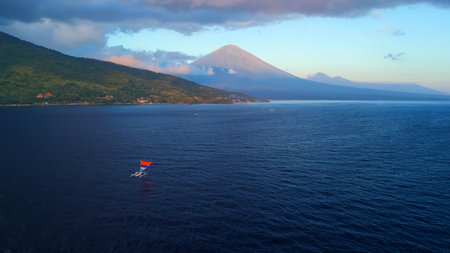 Sunrise Over Mount Agung From Amed Coast, Bali: Aerial Seascape Viewの写真素材